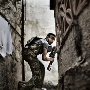 Italian Fabio Bucciarelli, Italy, Agence France-Presse, 2nd Prize Spot News Stories 10 October 2012, Aleppo, Syria. A Free Syrian Army fighter takes up position in the Sulemain Halabi district, a rebel stronghold, during clashes with government forces. The Syrian commercial hub of Aleppo was the scene of some of the bloodiest clashes in the ongoing uprising against the regime of President Bashar al-Assad. Both government and opposition forces considered control of Aleppo to be strategically important to their aims.